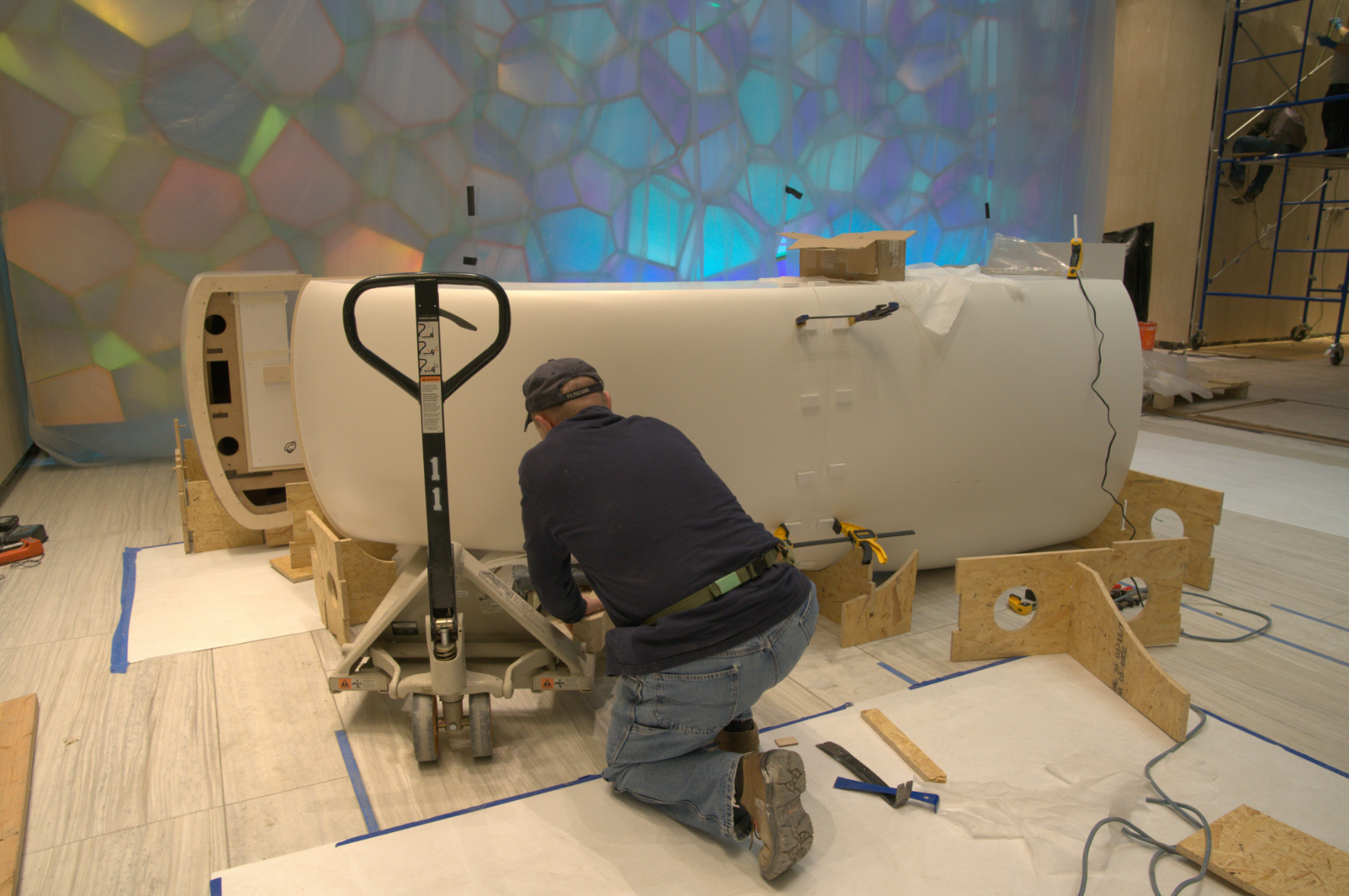 A man working on a bathroom.