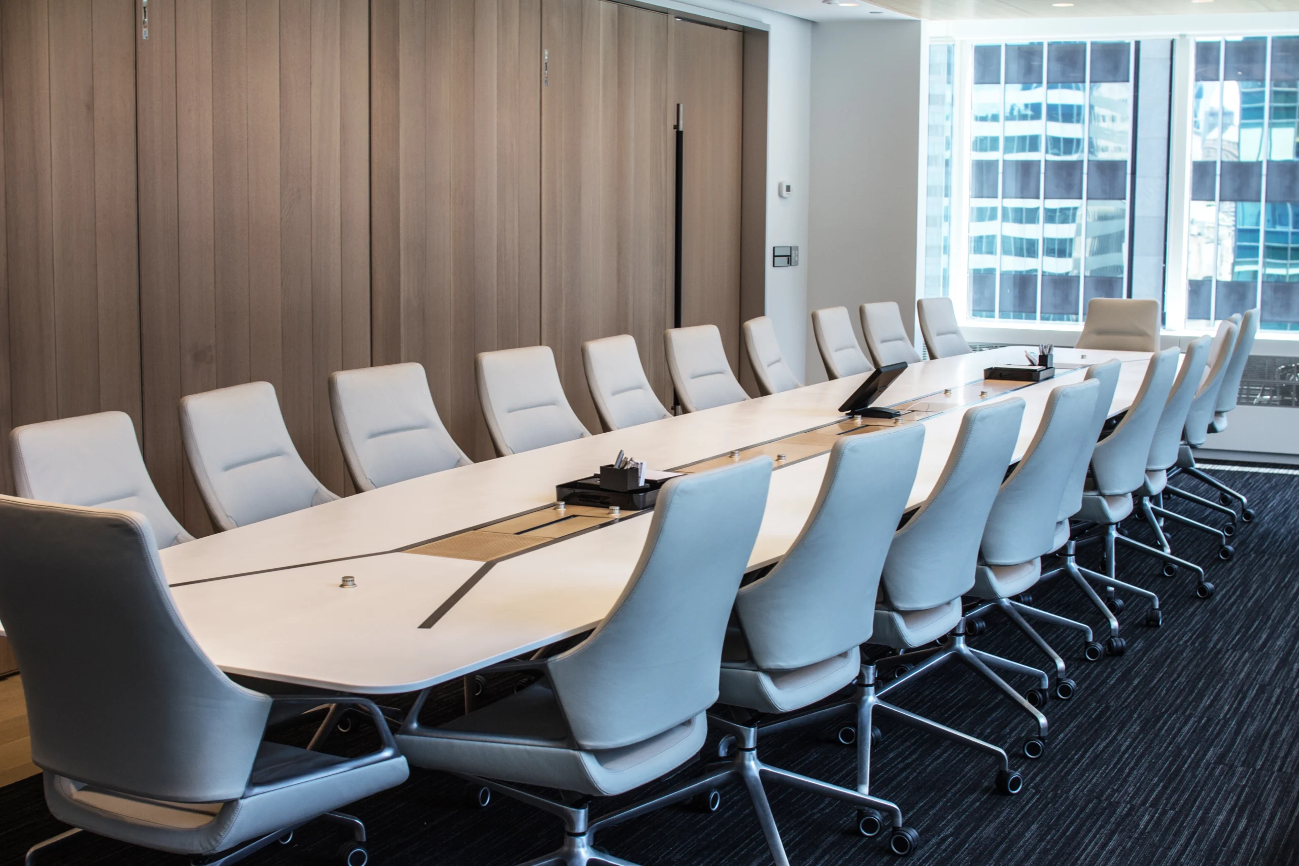 A Corian Boardroom table presented in glacier White and natural Maple.