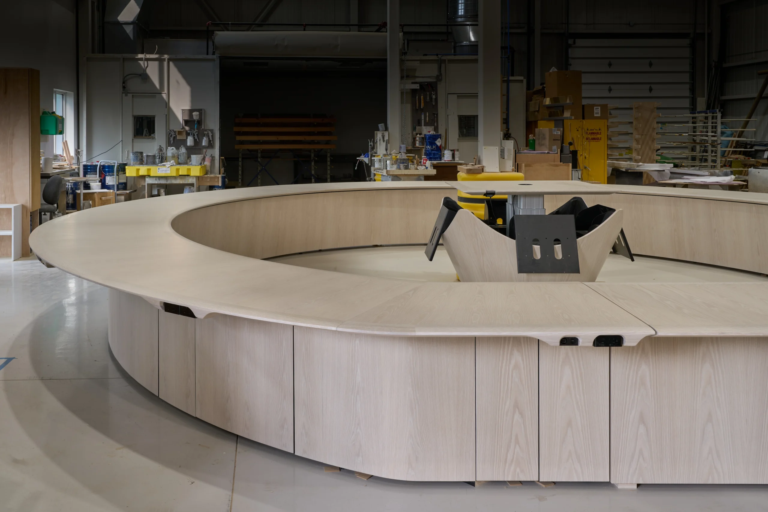 A board room table shown in the shop during the end of fabrication